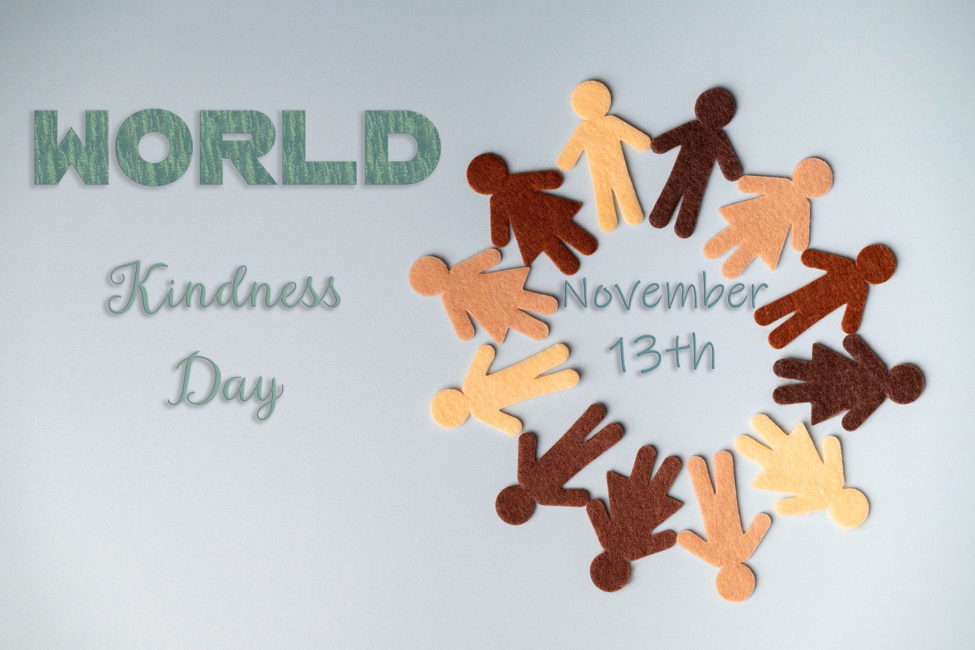 World kindness day concept. Fabric people shapes of different ethnicities circled together to celebrate kindness.
